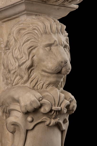 istock plaster lion sculpture, pommel column on a black background 827246274