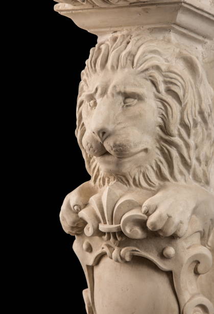 istock plaster lion sculpture, pommel column on a black background 827246474