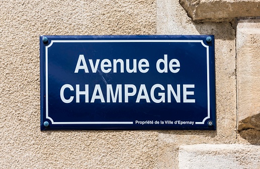 Epernay: Road sign of the street 'Avenue de Champagne' at a wall in Champagne district, France.