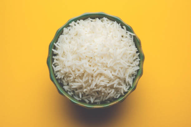 istock basmati rice in a ceramic bowl, indian white and long basmati rice cooked and served in bowl, selective focus 827251990