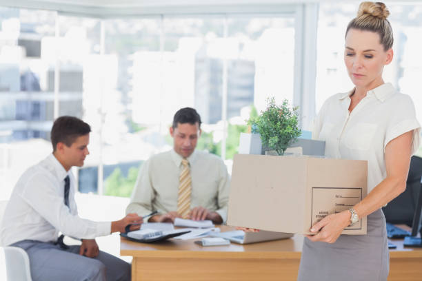 istock Businesswoman leaving office after being fired 827255174