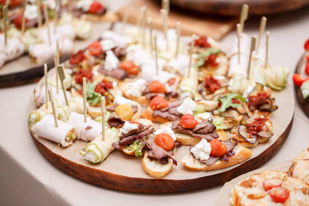 istock Assorted canape with cheese, meat, rolls, bakery and vegetables. selective focus 827263528