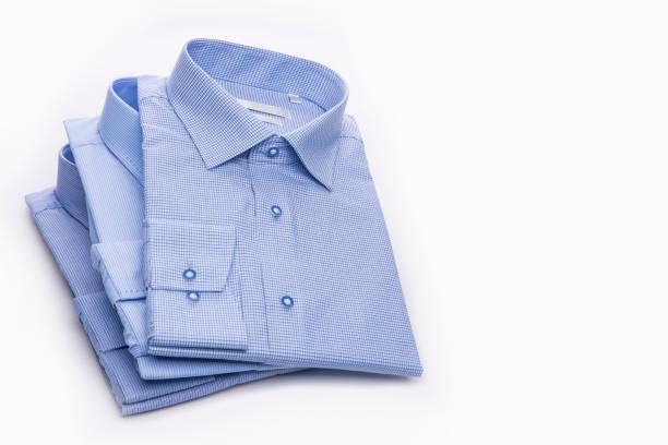 istock Three blue men's shirts folded in a pack on a white background. 827265832