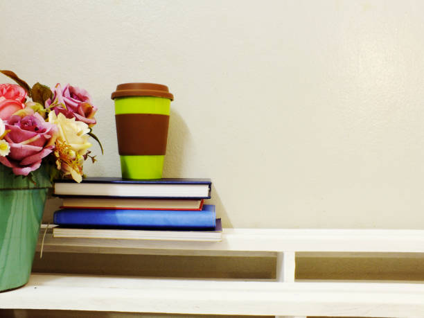 istock cup of coffee and book on wooden table 827266260