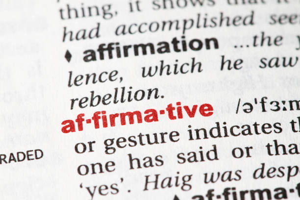 istock Closeup of English dictionary page with word AFFIRMATIVE. 827270280