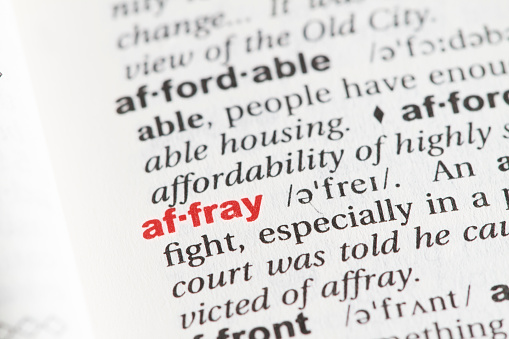 Closeup of English dictionary page with word AFFRAY.