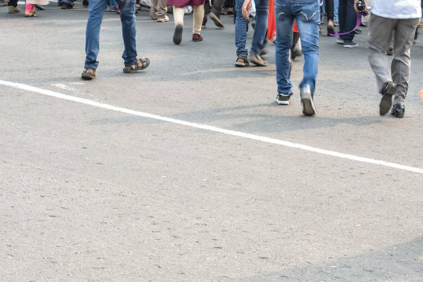 istock Pedestrians crossing road 827272546