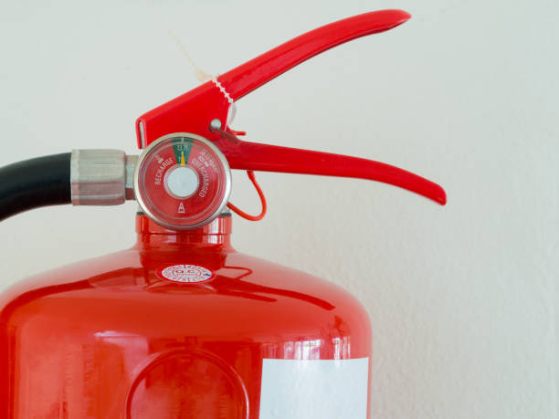 istock close up, Fully Charged Meter on red Fire Extinguisher. 827273210