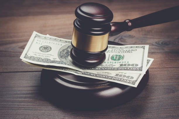 judge gavel and money on brown wooden table judge gavel and money on brown wooden table concept bill legislation photos stock pictures, royalty-free photos & images
