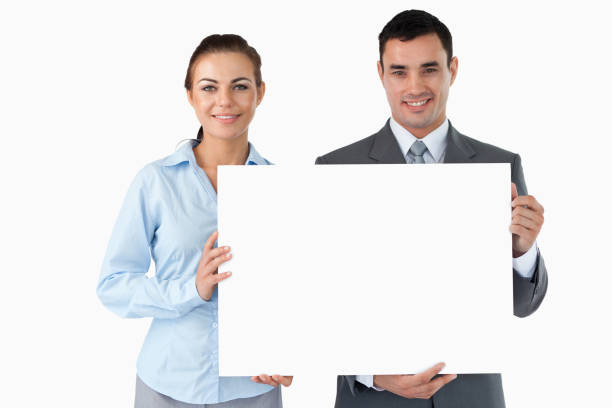 istock Business partners presenting sign 827280274