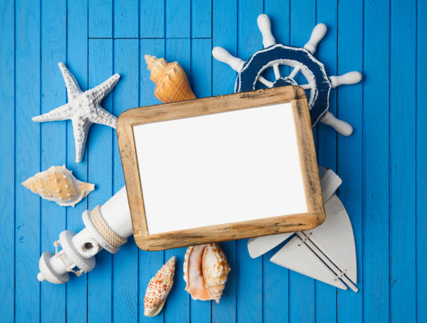 istock Summer holiday vacation photo frame mock up template with nautical decorations. View from above 827284518