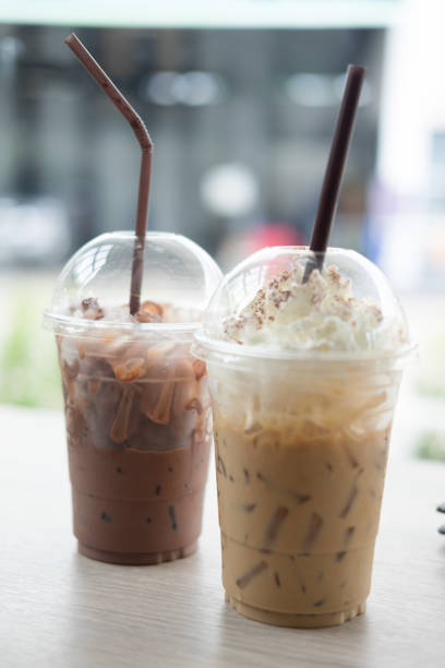 istock Ice coffee with whipped cream and Iced cocoa on table 827288500