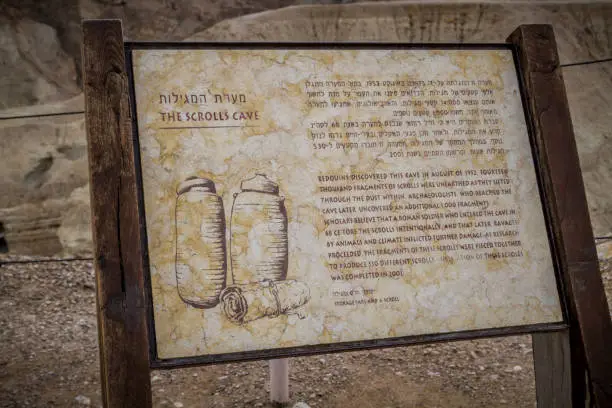 Information board of Scrolls Cave in Qumran National Park near the Dead Sea in Israel