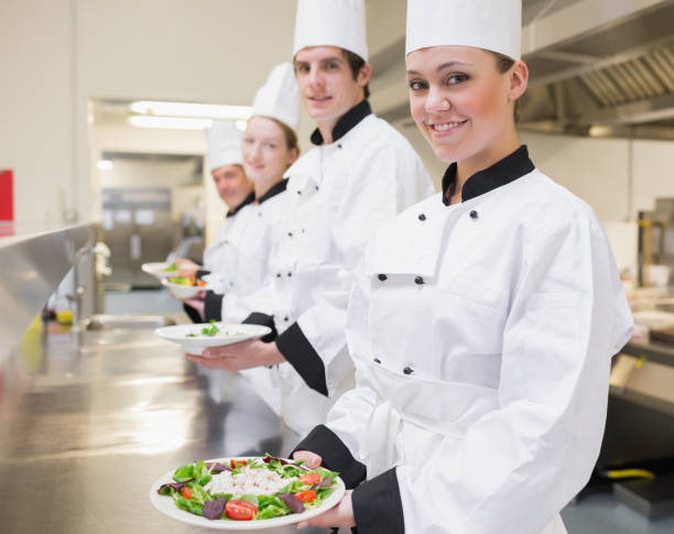 istock Happy Chefs showing their salads 827292188