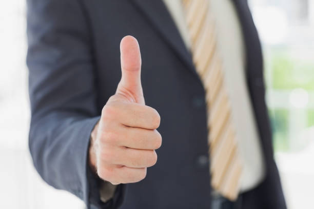 istock Businessman giving thumbs up 827295100
