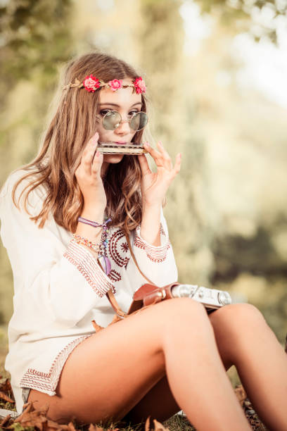 Hippie woman Hippie woman doing fun in nature harmonica stock pictures, royalty-free photos & images