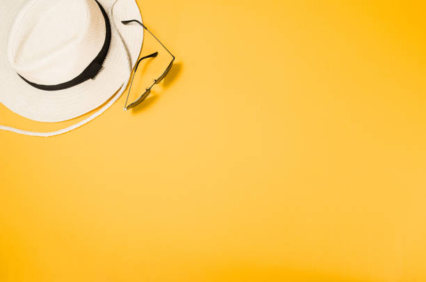 istock Accessories for travel top view yellow background with copy space 827299442