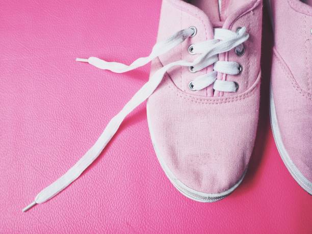 istock Sneakers on pink background 827300170