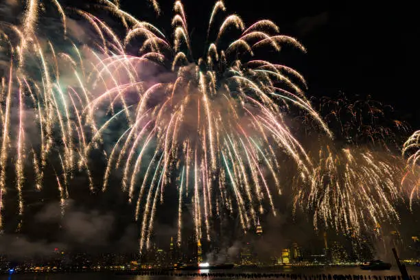 New York, NY USA - July 4, 2017: A fireworks show lights up the sky over New York City skyline