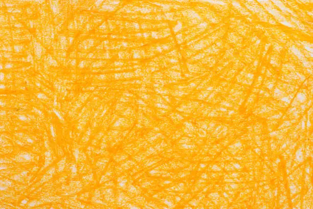 Photo of yellow crayon doodles background texture