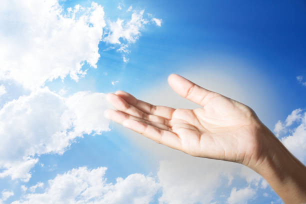 istock Female hand palm up with sky screen. 827303252