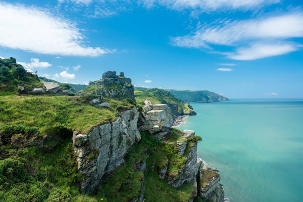 The South West Coast Path near Lynmouth Hiker on the headland in Valley of the Rocks on South West coast path near Lynmouth devon photos stock pictures, royalty-free photos & images