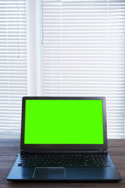 istock laptop with green screen vertical shot 827311680