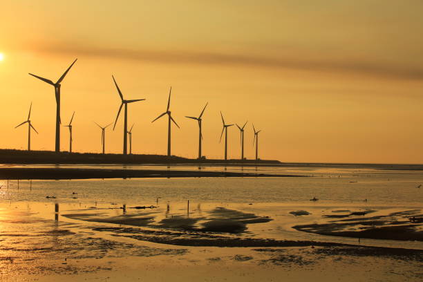 istock sunset of wind farm 827311928