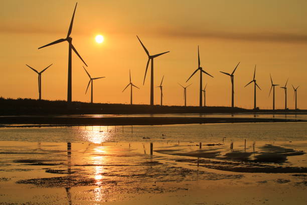 istock sunset of wind farm 827312184