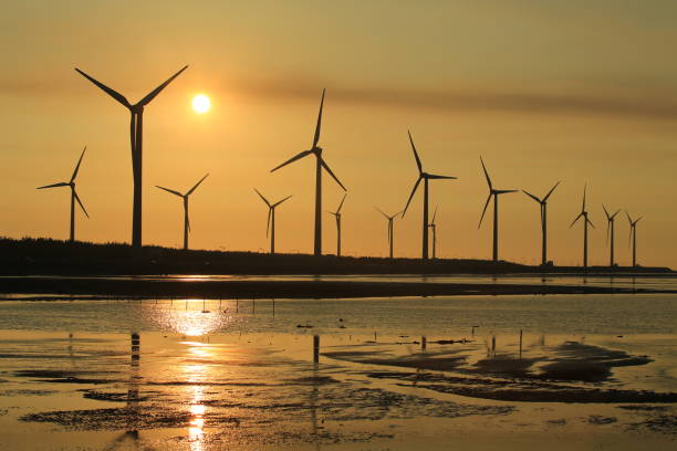 istock sunset of wind farm 827312466