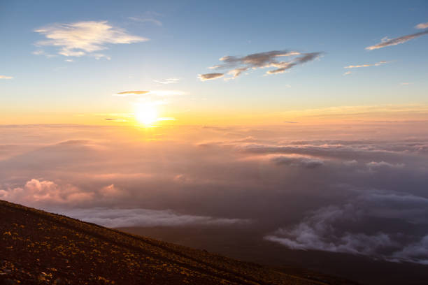 istock Sunrise above clouds and warm sky. 827312644