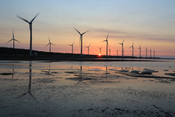 istock sunset of wind farm 827312666