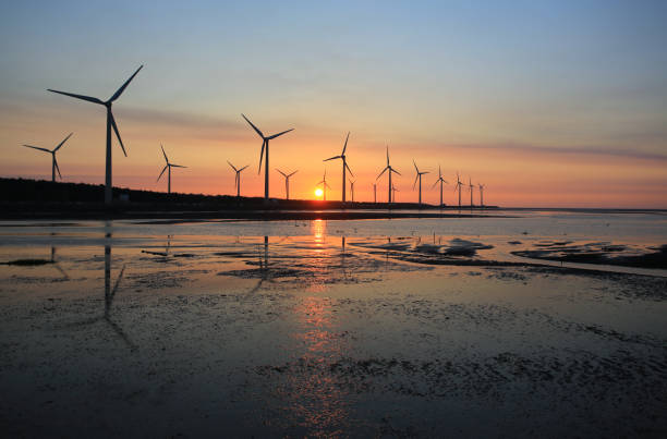 istock sunset of wind farm 827312700