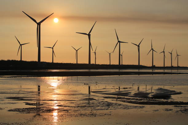 istock sunset of wind farm 827312758