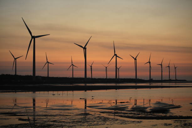 istock sunset of wind farm 827312784