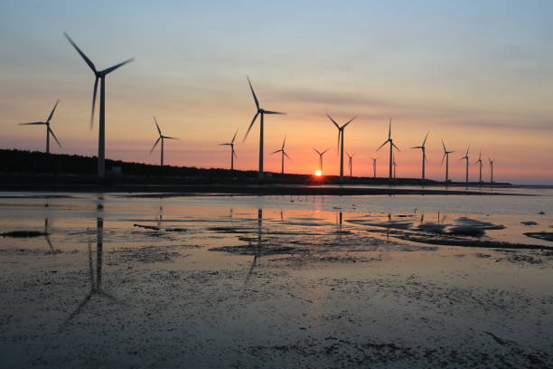 istock sunset of wind farm 827312808