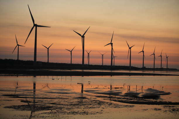 istock sunset of wind farm 827312832
