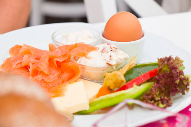 Healthy breakfast with smoked salmon creamy horseradish and a cottage cheese with tomatoes