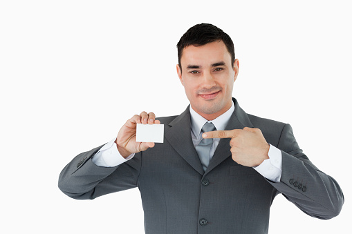 Businessman pointing at his businesscard