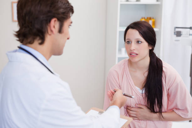 istock Doctor having serious conversation with patient 827323570