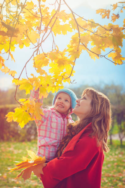 istock Mother with child outdoors in autumn 827324054