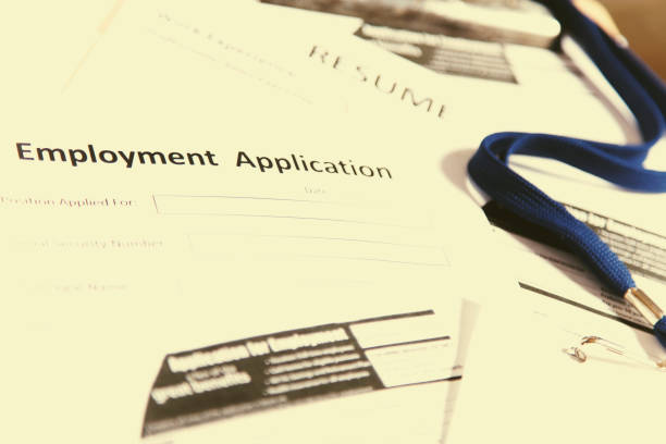 istock Job fair table with employment applications, resumes. 827324066