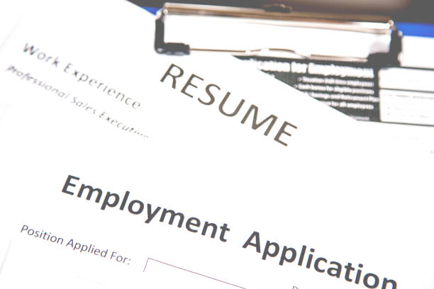 istock Job fair table with employment applications, resumes. 827324146