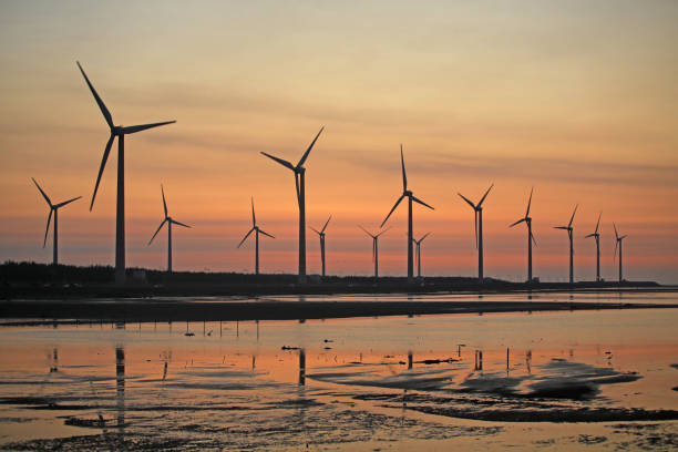 istock sunset of wind farm 827327464