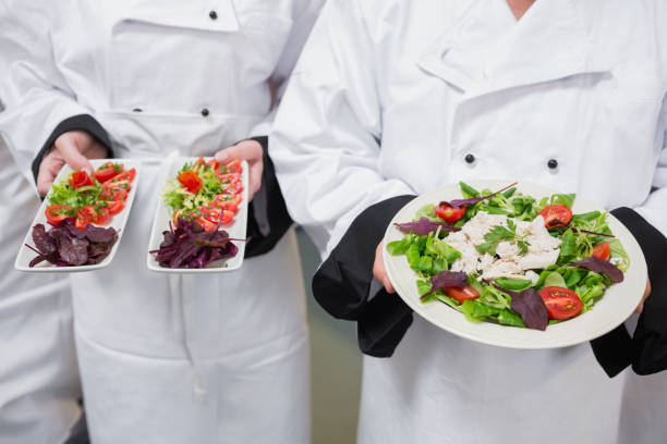 istock Chefs holding out their salads 827333222