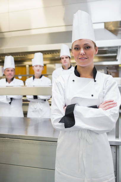 istock Smiling chef with crossed arms 827333414