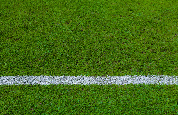 istock Green empty football soccer field 827333756