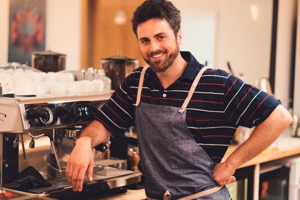 istock Smiling barista looking at camera 827337426