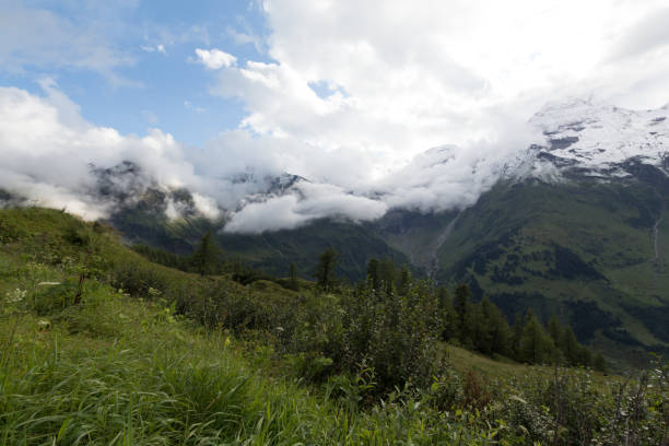 istock Clouds and snow in summertime in Austria 827338510