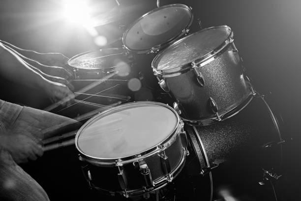 istock The man is playing drum set in low light background. 827341250